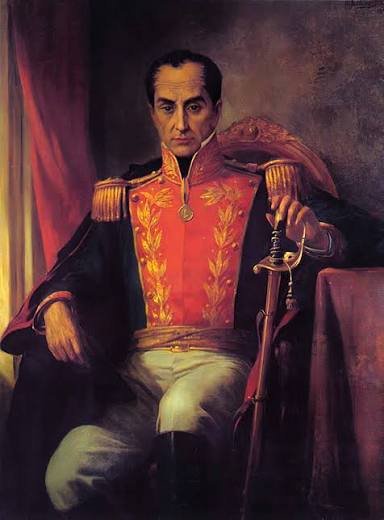 Retrato pictórico de Simón Bolívar sentado, en uniforme militar de gala con casaca roja bordada, sosteniendo una espada